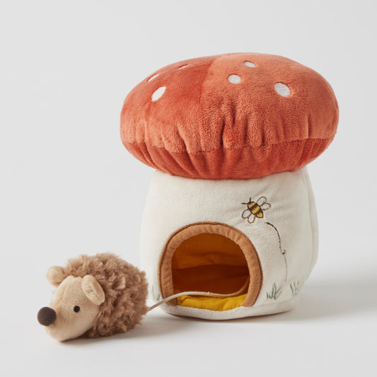 Mushroom house with hedgehog